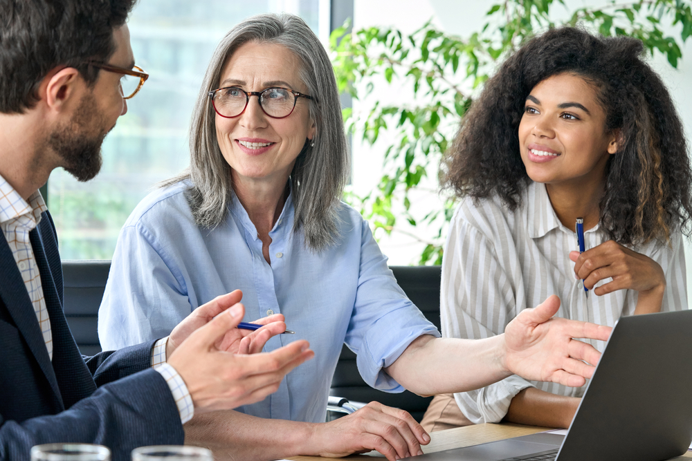 Happy,Diverse,Business,People,Group,Negotiating,Business,Strategy,At,Boardroom